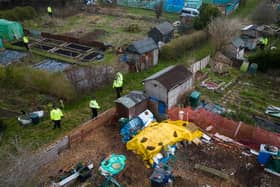 A police search team works through an allotment area as they continue to search for the missing baby in Brighton (Photo by Leon Neal/Getty Images).