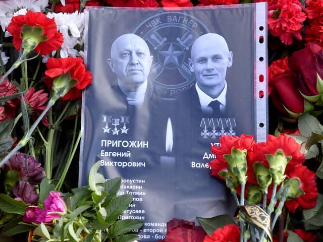 Sheet of paper with portraits of Yevgeny Prigozhin and Dmitry Utkin, a shadowy figure who managed Wagner’s operations and allegedly served in Russian military intelligence, is placed at a makeshift memorial in front of the Private Military Company (PMC) Wagner Centre in Saint Petersburg, on August 26.