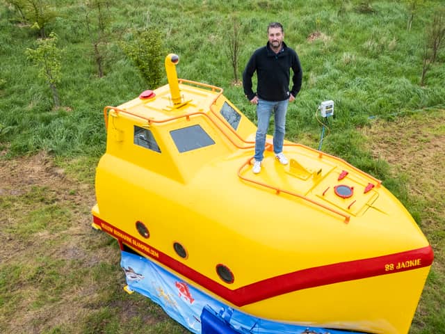 A lifeboat found floating in the sea has been turned into a real-life Yellow Submarine for glamping. 