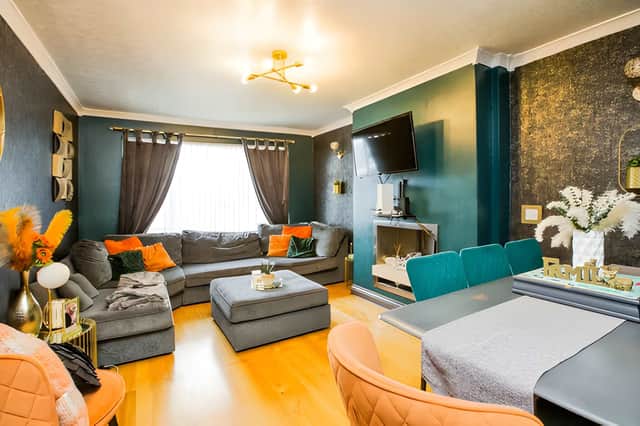 A comfortable lounge sits alongside a separate dining room, giving the family home two distinct reception spaces