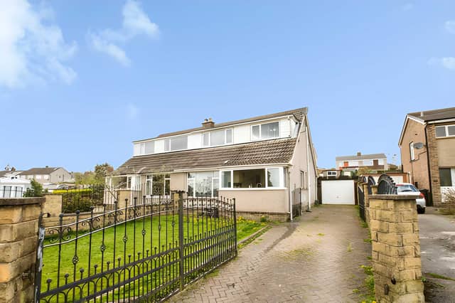 The Halifax home has a spacious front garden alongside driveway parking and a garage for added convenience