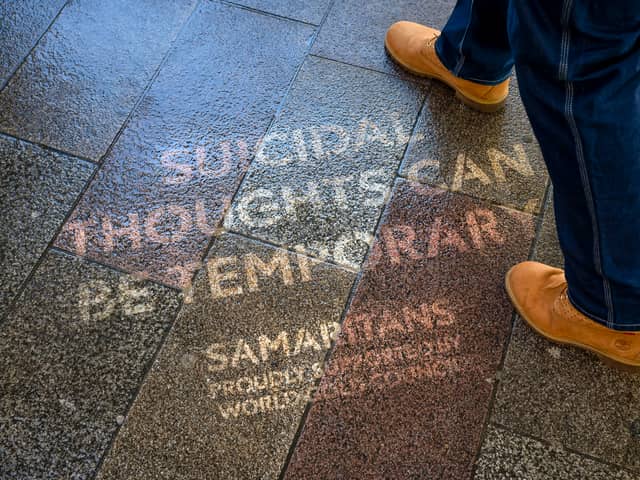 The quotes were made using reverse graffiti, and appear on pavements across London