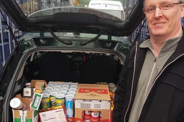 Eoin McDonnell, a regular donator who brought down his boot full of supplies for the Christmas hamper collections.