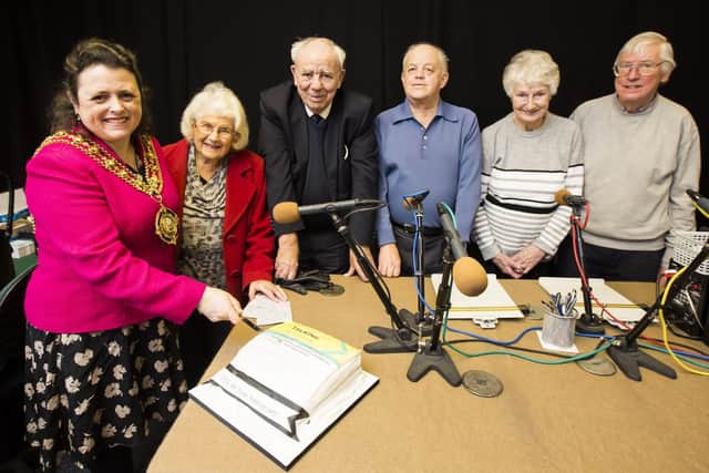 Calderdale Talking Newspaper Association 40th anniversary. Cutting the cake, from the left, Mayor of Calderdale councillor Dot Foster, reader Jennifer Pell, reader and chairman Roger Simpson, technician Dave Wozencroft, listener Dorothy Barker and Nigel Sutcliffe. Photo by Jim Fitton.