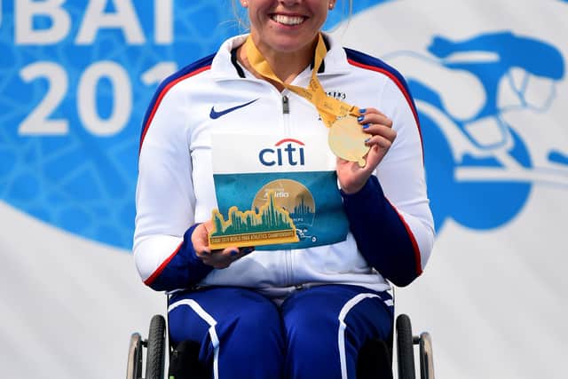 DUBAI, UNITED ARAB EMIRATES - NOVEMBER 14: Hannah Cockroft of Great Britain is presented with gold medal after winning the Women's 800m T34 final race on Day Eight of the IPC World Para Athletics Championships 2019 Dubai on November 14, 2019 in Dubai, United Arab Emirates. (Photo by Tom Dulat/Getty Images)