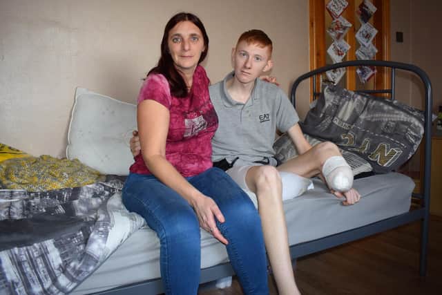 Ms Bland with her son Nathan, 20, who suffered the incident at work in late November