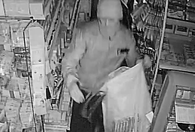The front view of one of the burglars which broke into the newsagents in Halifax