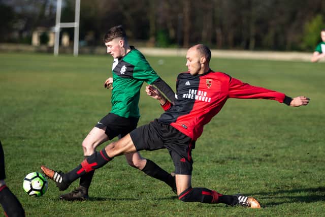 Actions from Thrum Hall FC v Wire Works FC, at Savile Park. Pictured is Ben Roach and Regan Martin