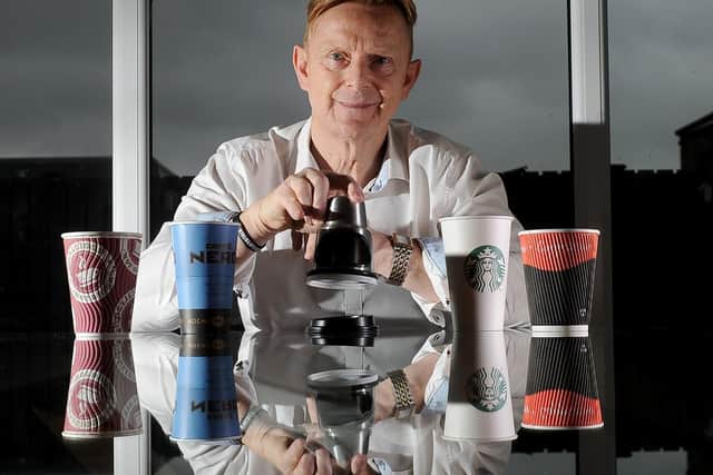 Richard Wolfdenden pictured with his invention called Lid Safe, which helps coffee shops apply lids to coffee shops safely, at his home at Shelf, Halifax.