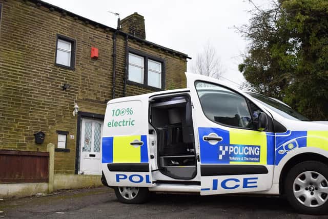 A CSI van parked outside the home on Carr House Lane