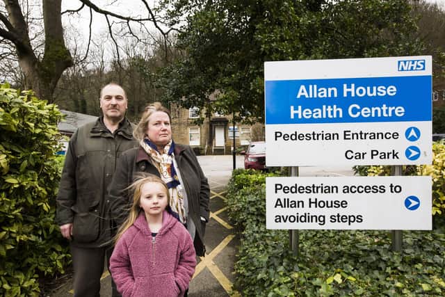 Dale Group Practice closing. Patients Robert Hills, Michelle Hills and Amelia Bedford, seven, outside Allan House Health Centre, Sowerby Bridge.