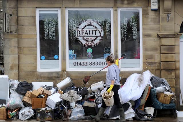 Flooding aftermath after Storm Ciara at Mytholmroyd. Staff at the Beauty Bank clear up after the flood devastation. Picture by Simon Hulme