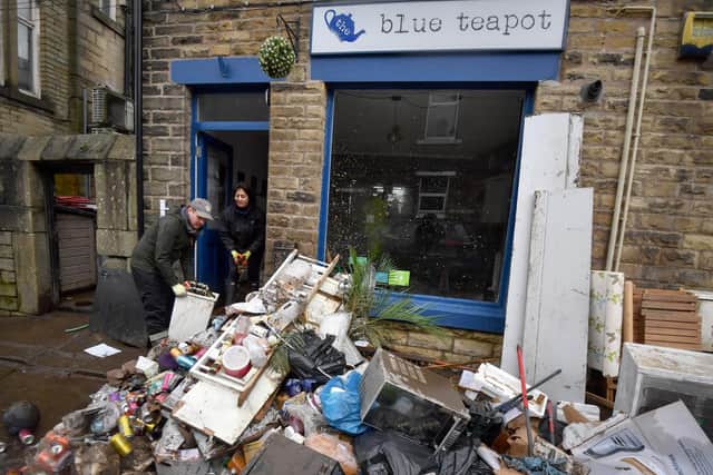 Staff beginning cleaning the Blue Tea Pot cafe as residents begin clearing up following severe flooding beside the River Calder on February 10, 2020 in Mytholmroyd,  (Photo by Anthony Devlin/Getty Images)