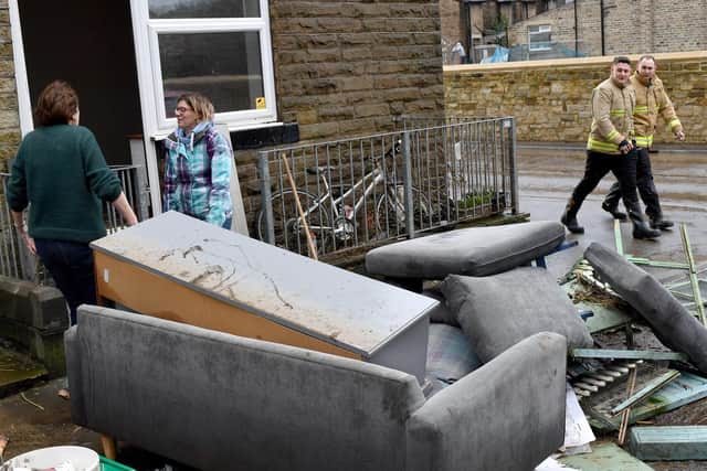 Residents begin clearing up following severe flooding beside the River Calder on February 10, 2020 in Mytholmroyd, (Photo by Anthony Devlin/Getty Images)