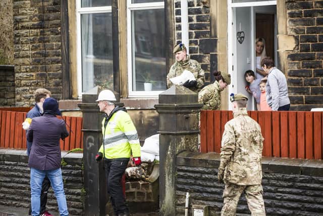 Army helps prapare Mytholmroyd for further flooding. Members of the 4th Battalion Royal Regiment of Scotland put sandbags out in Mytholmroyd.