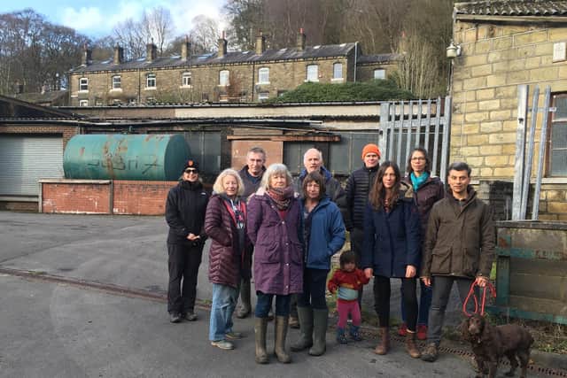 Crimsworth Dean residents, pictured at the former Crimsworth Dyeworks site, are unhappy at designs for new homes there