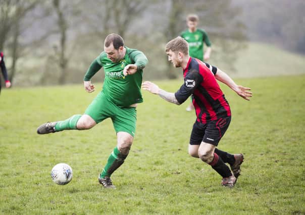 Saturday's game between Sowerby United (green) and Illingworth St Mary's was one of the last to be played in Calderdale for the forseeable future