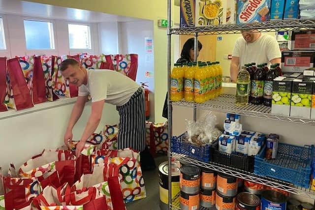 Photo of William Henry Smith School preparing food packs for delivery to students and to local foodbanks whose stick is running dry due to supermarkets being empty