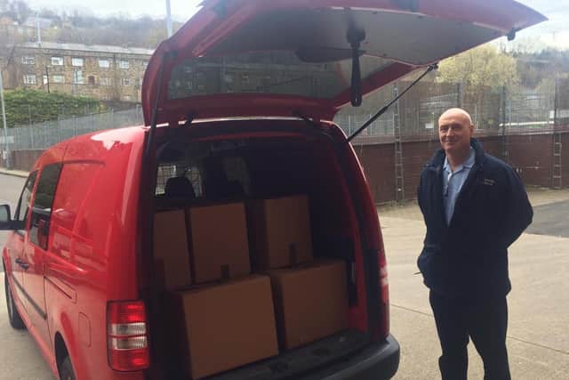 Andy Greenwood, a firefighter from West Yorkshire Fire & Rescue Service, on his way to deliver food parcels to those in greatest need in Calderdale