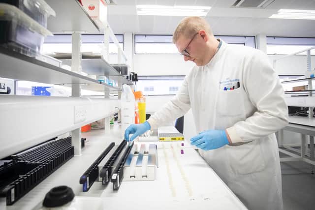 Clinical support technician extracts viruses from swab samples so that the genetic structure of a virus can be analysed and identified in the coronavirus testing laboratory at Glasgow Royal Infirmary (Photo by Jane Barlow - WPA Pool/Getty Images) Copyright: Getty