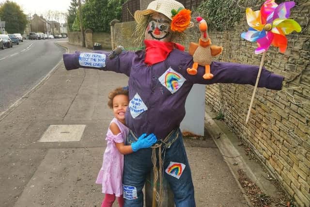 Fleur Cormack with her scarecrow