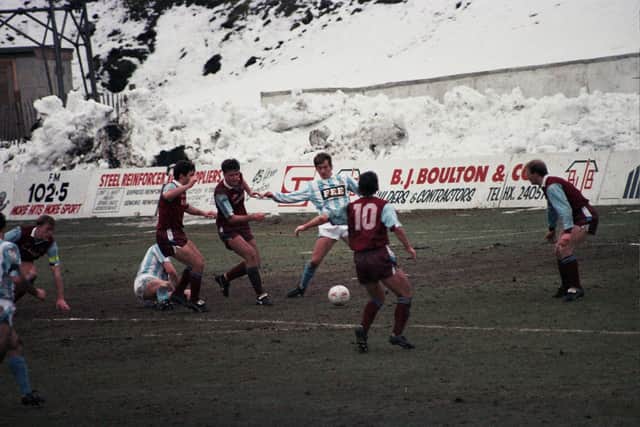 Steve Norris takes on three defenders against Burnley during the 1990-91 season. Photo: Keith Middleton