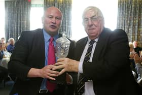 Brian Moore presents a cup to Harry Wolstenholme at Old Crossleyans for 60 years service to the club at a special dinner