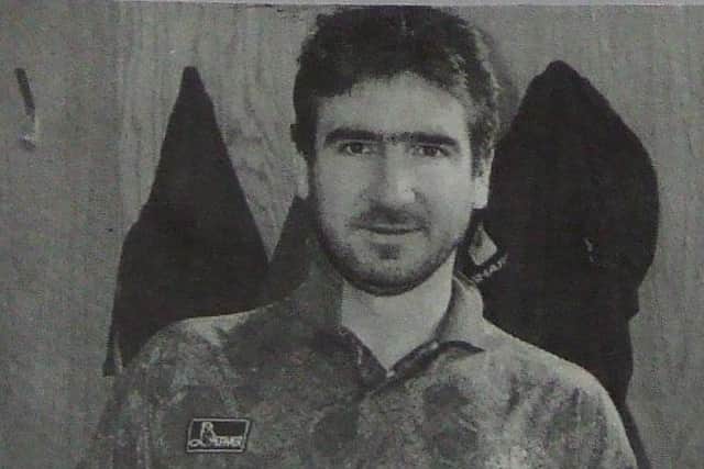 Manchester United star Eric Cantona poses in a Halifax Town shirt that was signed by high profile players as part of the Supporters’ Club ‘Fighting Fund’.