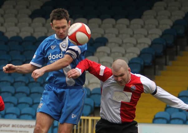 Bower gets his head to the ball at home to Ashton United