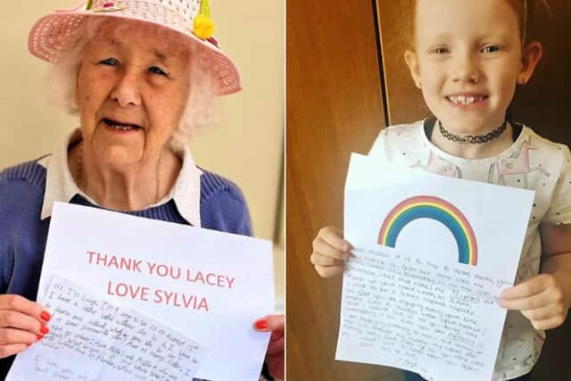 Sylvia, a resident at Pennine Lodge in Todmorden with her letter from pupil Lacey and pupil, Willow, with her letter from the care home.