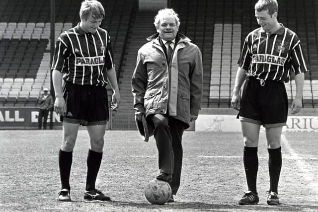 A touch of class: David Jason at the Shay for filming of 'A Touch of Frost' is pictured with Halifax Town players David German (left) and Billy Barr