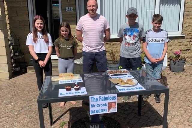 Teacher Dan Crook with pupils who took part in his bake-off challenge