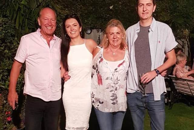 Mr Finch, with his family Olivia, 24, wife Julie, and son Ben, 29