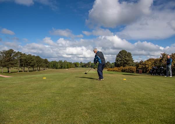Date: 13th May 2020.
Picture James Hardisty.
Golfers were returning to their clubs today for the first time since the UK Lockdown after the governments announcement to ease some restriction during Coronavirus pandemic and restart the economy. Pictured Graham Holden, tees, off watched by Chris Pennington, at Moortown Golf Club, Leeds.