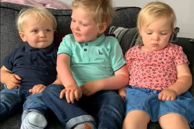 Oscar, with his younger brother and sister Jacob and Grace