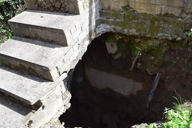 The hole in the rear garden is 30-foot deep according to Yorkshire Water