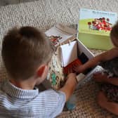 The boxes are filled with a range of activities aimed at prompting memories.