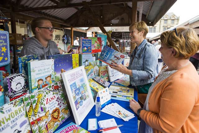 Brighouse Market. Pop's Book Nook owner Dulcie Clarkson with Kathy Dransfield and Olive Peel, front.