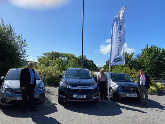 From left to right - Martin Duddridge of Ideal Autolease - Becki Marren of Overgate Hospice and Steve Brighton of Hepworth Motor Group