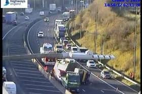 Motorists are facing long delays this afternoon after a vehicle overturned on the M62 at Birstall. Photo: Highways England