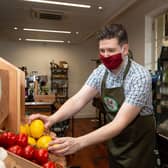 Ross Denby wearing a mask in store, at Just Gaia, The Piece Hall, Halifax