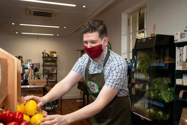 Ross Denby wearing a mask in store, at Just Gaia, The Piece Hall, Halifax
