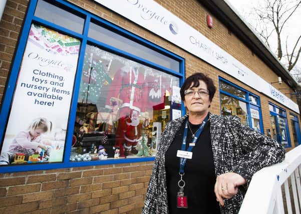 Manager of Hipperholme Overgate charity shop Pearl Hammond, locks up for the November lockdown