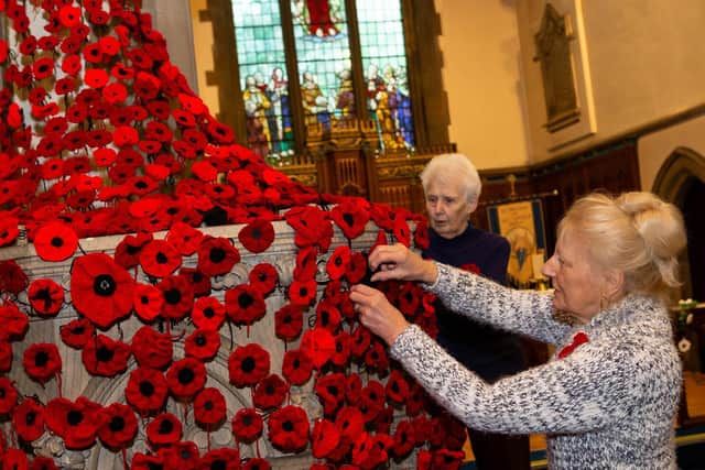 Krys Lyon and Anne Oade, parishioners with Remembrance displays, St Michael and all Angels Church, Shelf