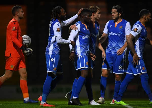 Moses Emmanuel of Wealdstone (centre) celebrates after scoring his sides first goal during the Vanarama National League match between Yeovil Town and Wealdstone at Huish Park on October 6. (Photo by Harry Trump/Getty Images)