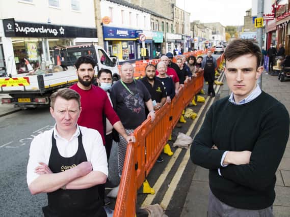 John Murphy (left) and Oliver Blackburn (right) with fellow traders, who opposed the barriers placed in Commercial Street way back in the summer