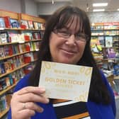 Anne Colley with one of the Golden Tickets at Brighouse Books.