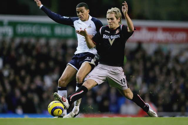 Martin Woods battles for the ball with Jermaine Jenas during the match between Tottenham Hotspur and Sunderland at White Hart Lane on December 3, 2005.  (Photo by Clive Rose/Getty Images)