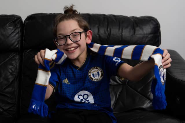 Young Halifax Town fan Charlie Potts has been raising money for a new wheelchair