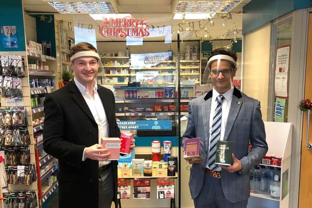 Coun George Robinson, left with Shaiyan Wirasat of Ramzy’s Pharmacy, which has donated hundreds of pounds worth of fragrances to be given out to local charities by Community Customers
